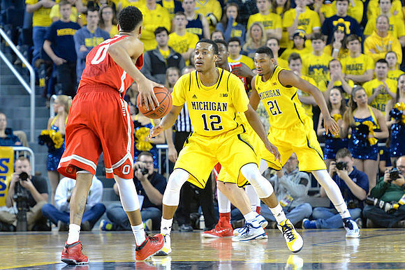 Muhammad-Ali Abdur-Rahkman (12) and Zak Irvin (21)