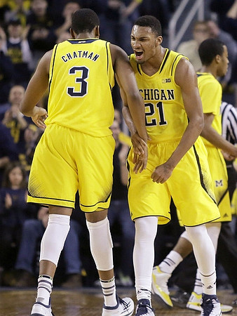 Kameron Chatman (3), Zak Irvin (21), and Muhammad-Ali Abdur-Rahkman (12)