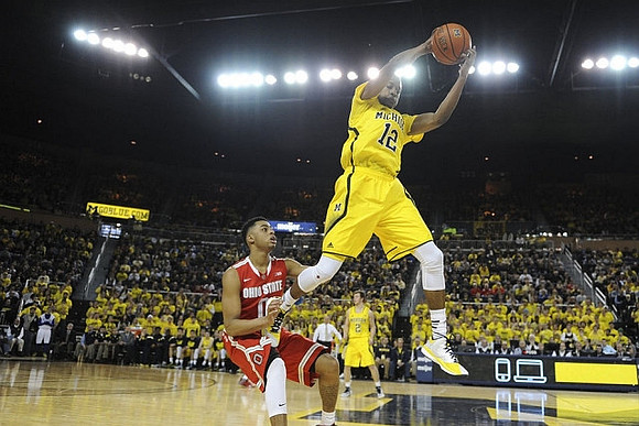 Muhammad-Ali Abdur-Rahkman (12) and Spike Albrecht (2)