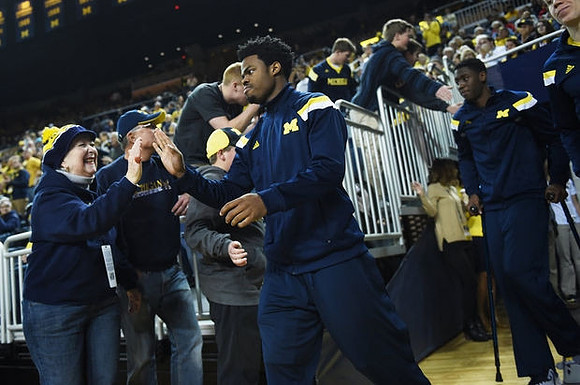 Derrick Walton Jr. (10) and Caris LeVert (23)