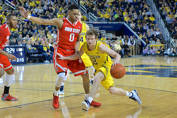 Mark Donnal (34) and Spike Albrecht (2)