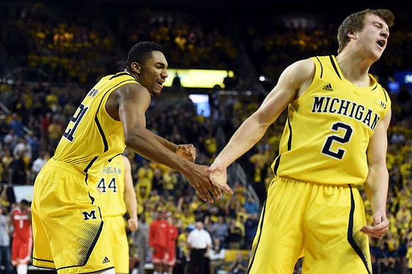 Zak Irvin (21), Max Bielfeldt (44), and Spike Albrecht (2)