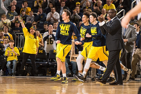 Andrew Dakich (11), D.J. Wilson (5), Sean Lonergan (20), and Bacari Alexander