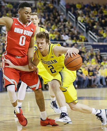 Spike Albrecht (2) and Mark Donnal (34)
