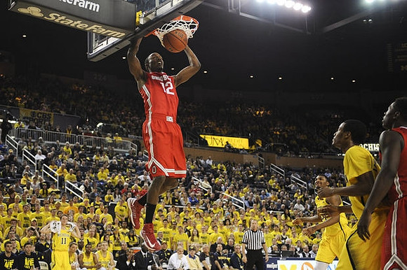 Zak Irvin (21) and Muhammad-Ali Abdur-Rahkman (12)