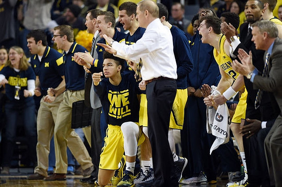 D.J. Wilson (5), John Beilein, Ricky Doyle (32), and Jeff Meyer