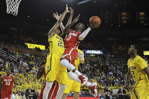 Zak Irvin (21) and Muhammad-Ali Abdur-Rahkman (12)