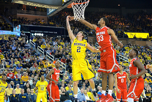 Zak Irvin (21), Muhammad-Ali Abdur-Rahkman (12), and Spike Albrecht (2)