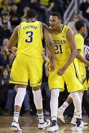 Kameron Chatman (3), Zak Irvin (21), and Muhammad-Ali Abdur-Rahkman (12)