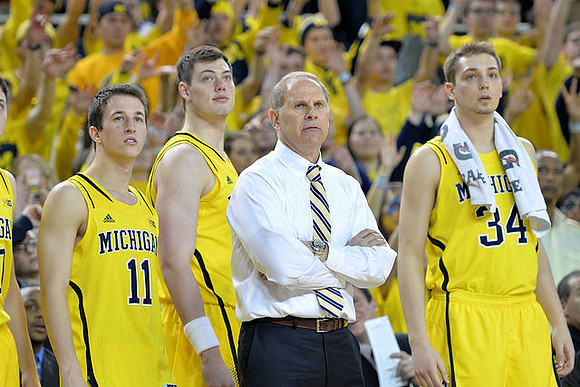 Andrew Dakich (11), Ricky Doyle (32), John Beilein, and Mark Donnal (34)
