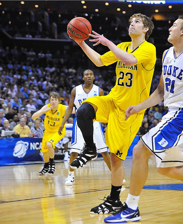 Evan Smotrycz (23) and Matt Vogrich (13)
