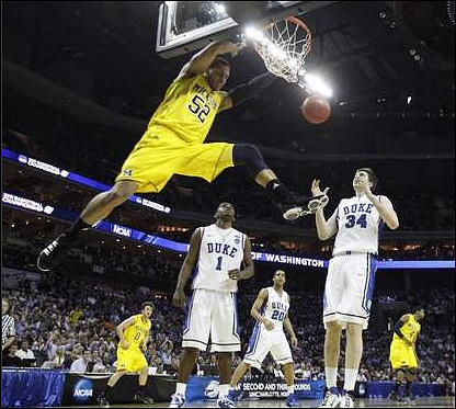 Jordan Morgan (52), Zack Novak (0), and Darius Morris (4)