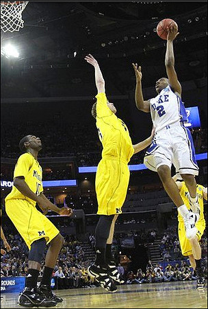 Tim Hardaway Jr. (10) and Evan Smotrycz (23)