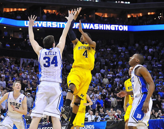 Darius Morris (4) and Jordan Morgan (52)