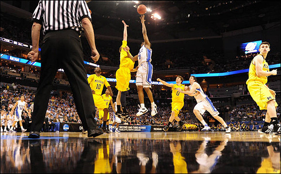 Tim Hardaway Jr. (10), Darius Morris (4), Evan Smotrycz (23), Zack Novak (0), and Stu Douglass (1)