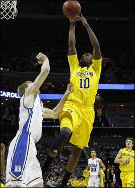 Tim Hardaway Jr. (10) and Zack Novak (0)