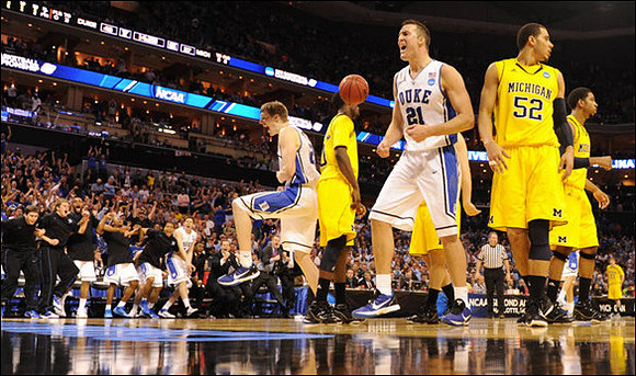 Tim Hardaway Jr. (10),  Jordan Morgan (52), and Darius Morris (4)