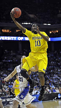 Tim Hardaway Jr. (10) and Zack Novak (0)
