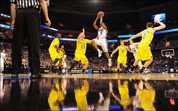 Tim Hardaway Jr. (10), Darius Morris (4), Evan Smotrycz (23), Zack Novak (0), and Stu Douglass (1)