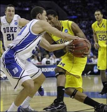 Darius Morris (4) and Jordan Morgan (52)