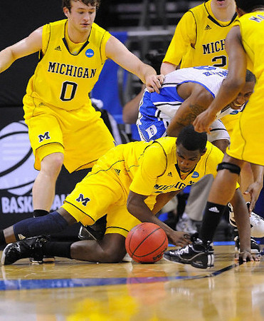 Zack Novak (0), Tim Hardaway Jr. (10), Evan Smotrycz (23), and Darius Morris (4)