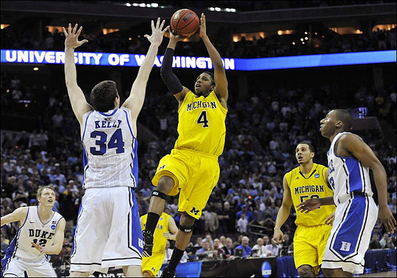 Darius Morris (4) and Jordan Morgan (52)