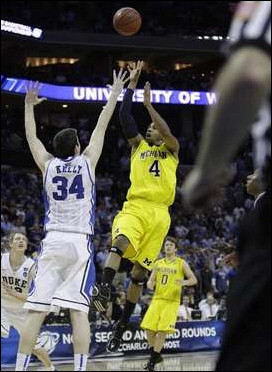 Darius Morris (4) and Zack Novak (0)