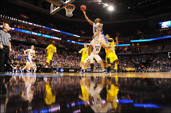 Tim Hardaway Jr. (10), Zack Novak (0), and Jordan Morgan (52)