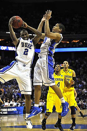 Darius Morris (4) and Jordan Morgan (52)