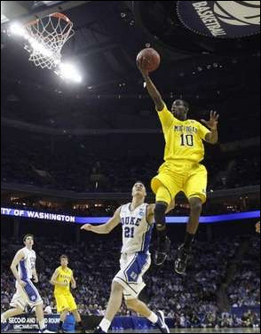 Tim Hardaway Jr. (10) and Zack Novak (0)