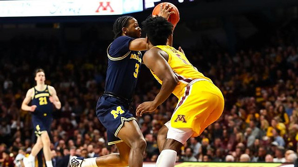 Franz Wagner (21) and Zavier Simpson (3)