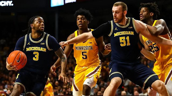 Zavier Simpson (3) and Austin Davis (51)
