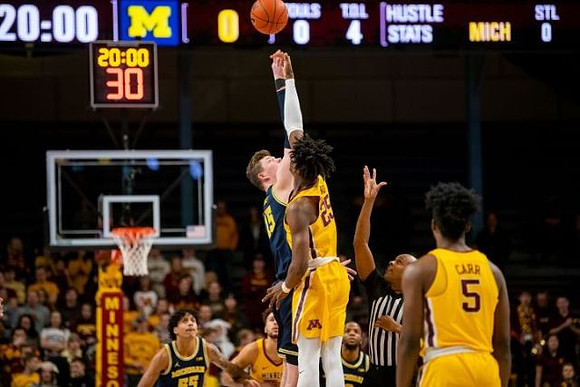 Eli Brooks (55) and Jon Teske (15)