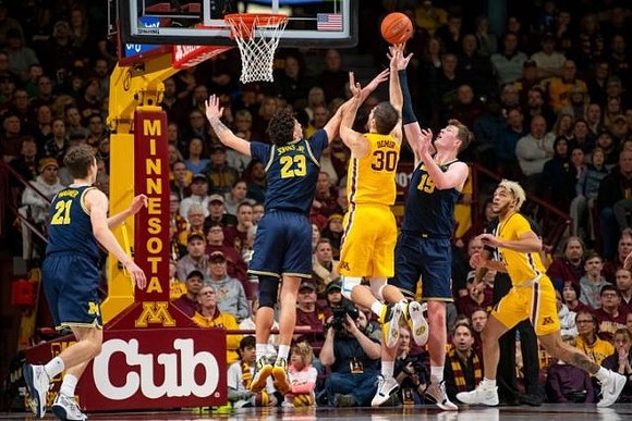 Franz Wagner (21), Brandon Johns Jr. (23), and Jon Teske (15)