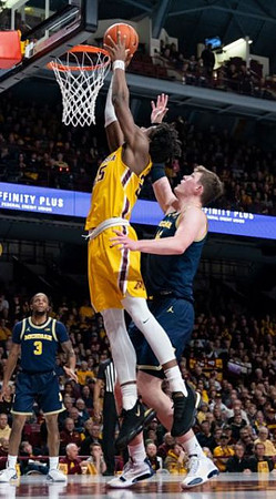 Zavier Simpson (3) and Jon Teske (15)