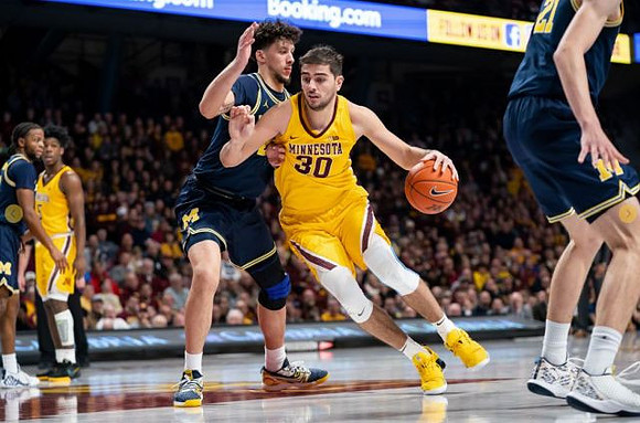 Zavier Simpson (3), Brandon Johns Jr. (23), and Franz Wagner (21)