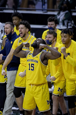 Chaundee Brown Jr. (15) and Michigan Team