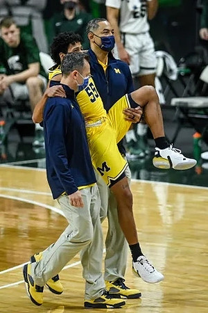 Eli Brooks (55) and Juwan Howard