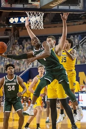 Franz Wagner (21), Hunter Dickinson (1), and Eli Brooks (55)