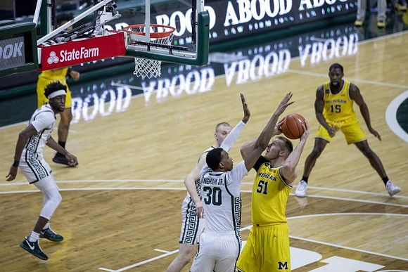 Austin Davis (51) and Chaundee Brown Jr. (15)