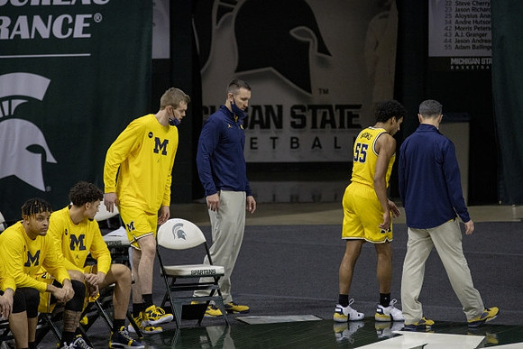 Juwan Howard and Eli Brooks (55)