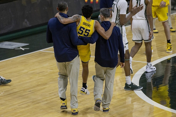 Juwan Howard and Eli Brooks (55)