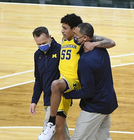 Eli Brooks (55) and Juwan Howard