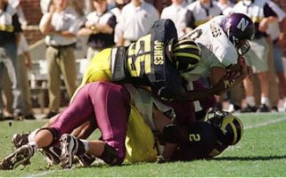 Dhani Jones (55) and Charles Woodson (2)