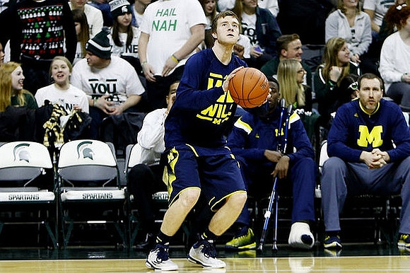 Spike Albrecht (2) and Caris LeVert (23)
