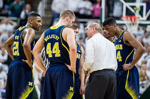Zak Irvin (21), Max Bielfeldt (44), Spike Albrecht (2), John Beilein, and Aubrey Dawkins (24)