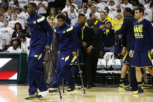 Caris LeVert (23), Derrick Walton Jr. (10), Zak Irvin (21), Bacari Alexander, and Austin Hatch (30)
