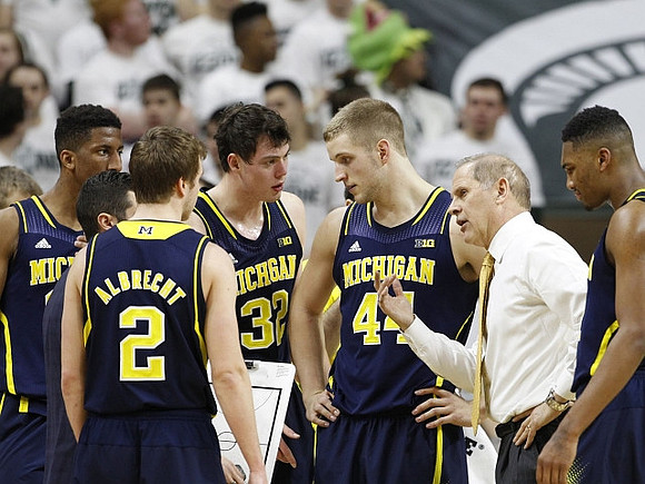 Aubrey Dawkins (24), Spike Albrecht (2), Ricky Doyle (32), Max Bielfeldt (44), John Beilein, and Zak Irvin (21)