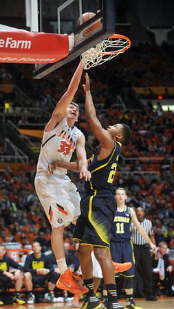 Zak Irvin (21) and Nik Stauskas (11)