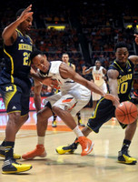 Zak Irvin (21) and Derrick Walton Jr. (10)